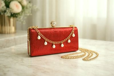 Red Glitter Clutch Bag With Gold Chain And Pearls
